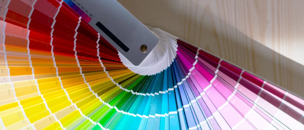 Fanned out book of color swatches.