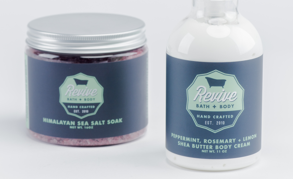Revive Bath + Body products, including a sea salt soak and body cream.