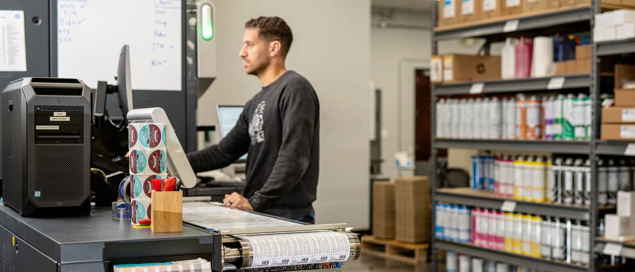 Professional digital press operator printing supplement labels.