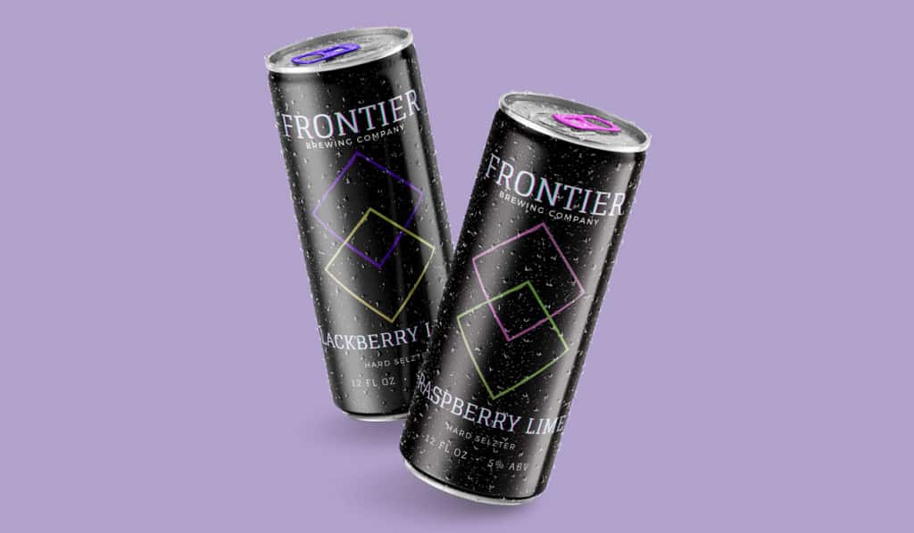 Digital mockup of a hard seltzer products against a light purple background. The hard seltzer labels are black with geometric designs. The flavors are raspberry lime and blackberry lemon.