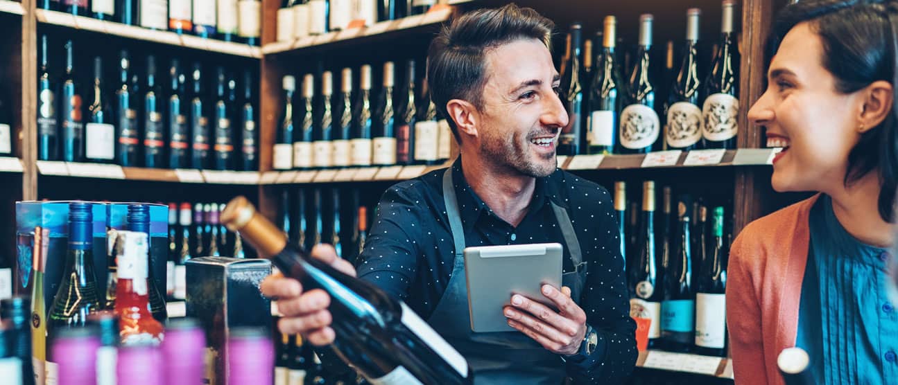 Private label wine maker chats with a new client.