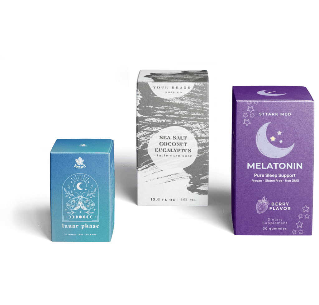 Three intricately designed product boxes. From left, there is a tea bag box with a blue gradient background and white design with moths and moons titled Lunar Phase. In the center is a black and white liquid hand soap box. On the right, there is a deep purple melatonin gummy box with moons and stars designed on it.
