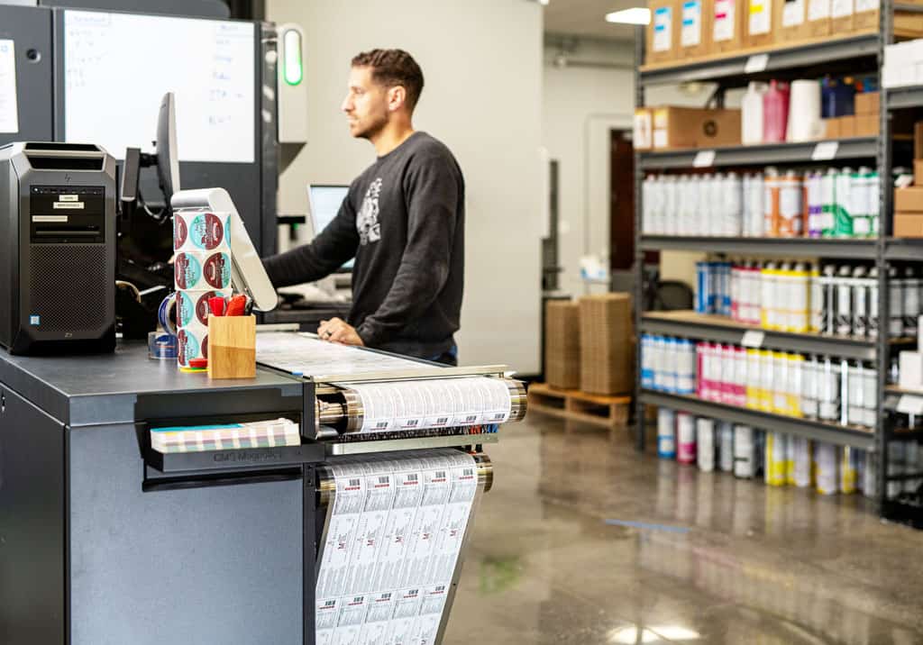Press operator printing a supplement label.