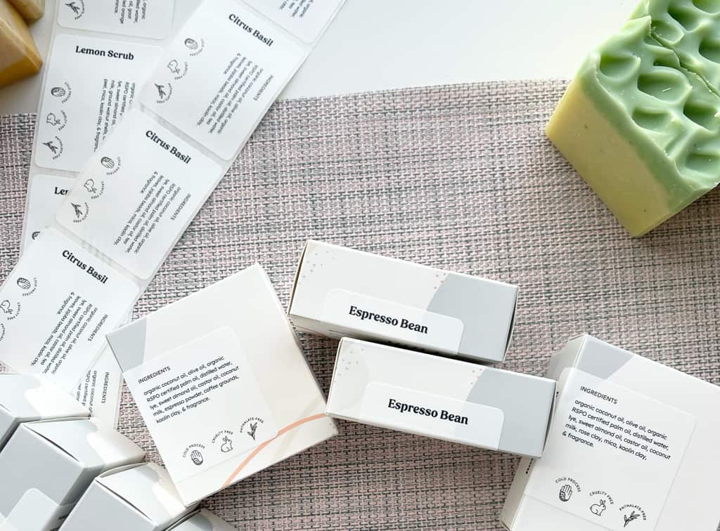 Handmade soap in custom printed boxes labeled with custom stickers.